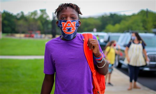 student smiles on first day of school